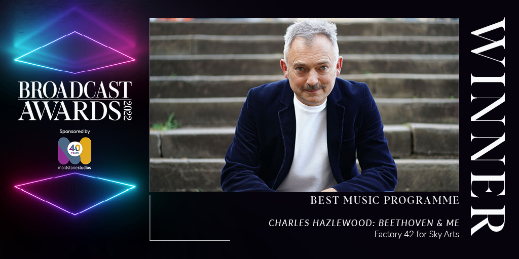 A white male in his fifties looks at the camera smiling. Text reads Broadcast Awards 2022 Winner. Best Music Programme. Charles Hazlewood: Beethoven and Me. Factory 42 for Sky Arts